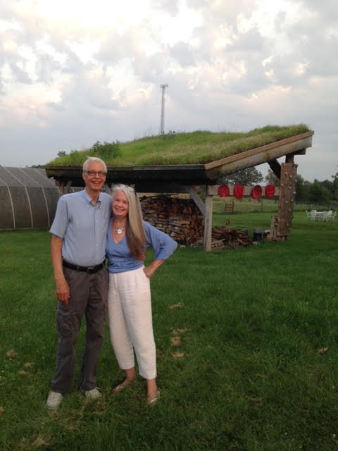 Picture of Mark and Kari in front of grassfoofed woodshed Picture of Mark and Kari in front of grassfoofed woodshed